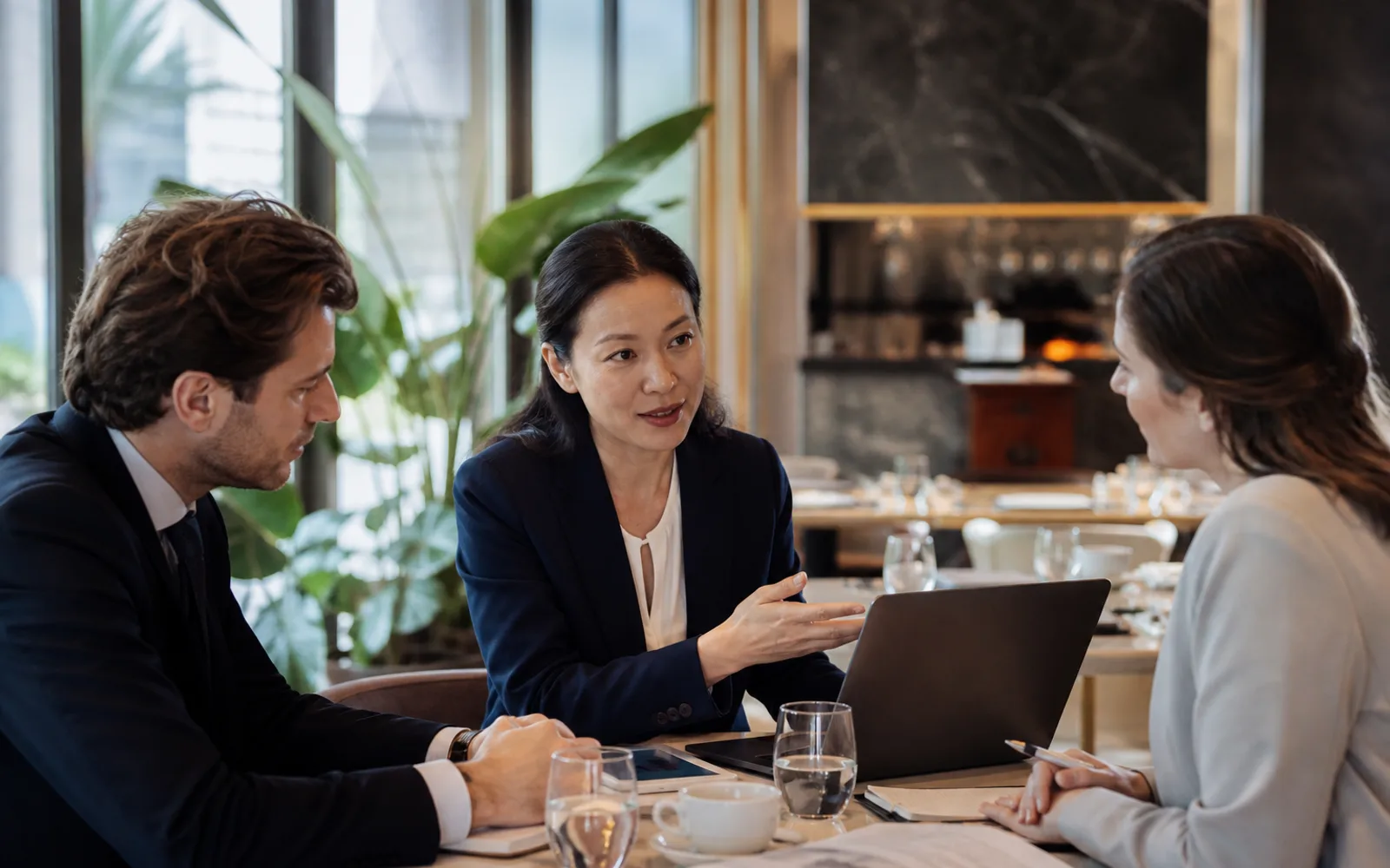 International professionals discussing opportunities around a workplace table